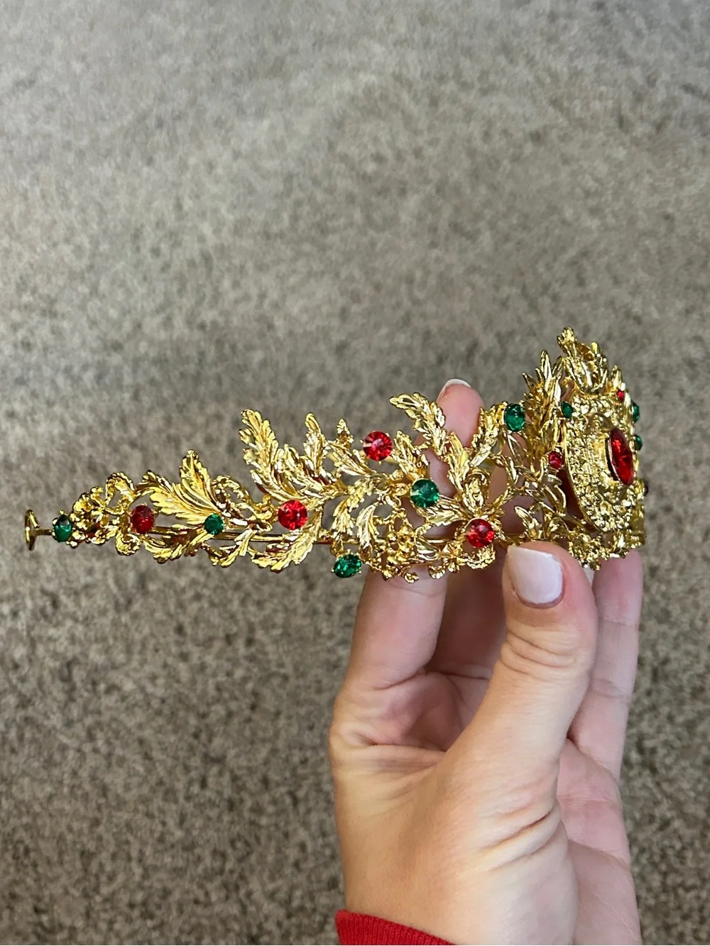 Gold colored crown headband with red and green faux gemstones